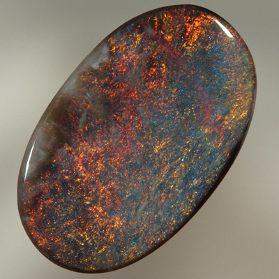 SOLID BLACK OPAL Burning red over a blue background